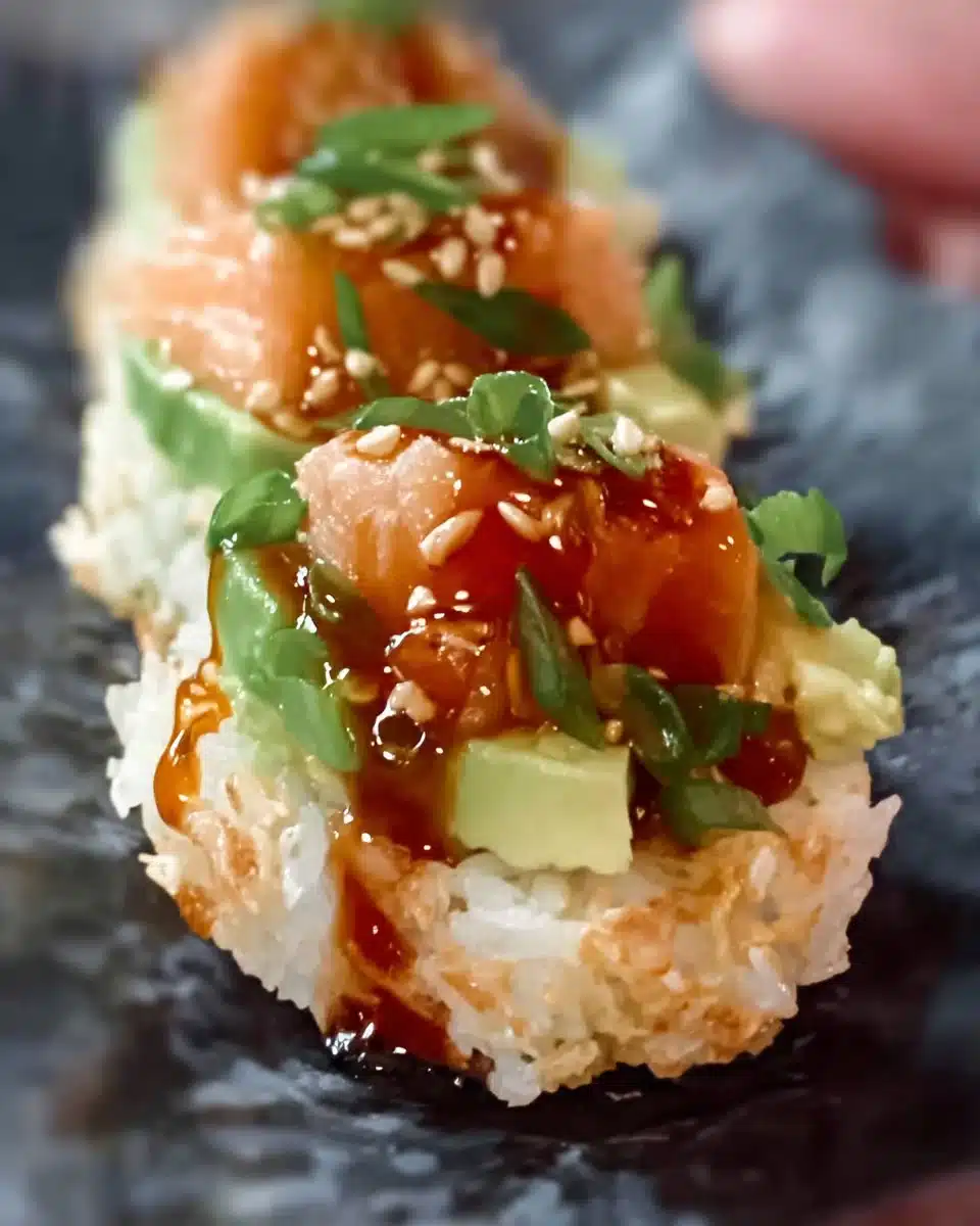 Crispy rice sushi bites with spicy salmon and avocado toppings
