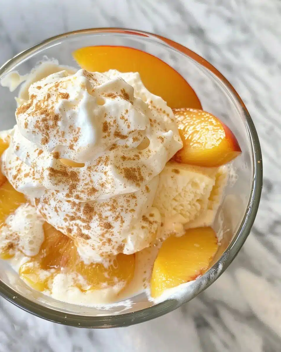 Delicious baked peaches topped with cinnamon and honey on a rustic plate.