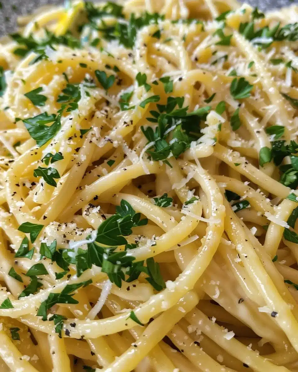 Plate of Garlic Butter Pasta garnished with parsley and parmesan cheese