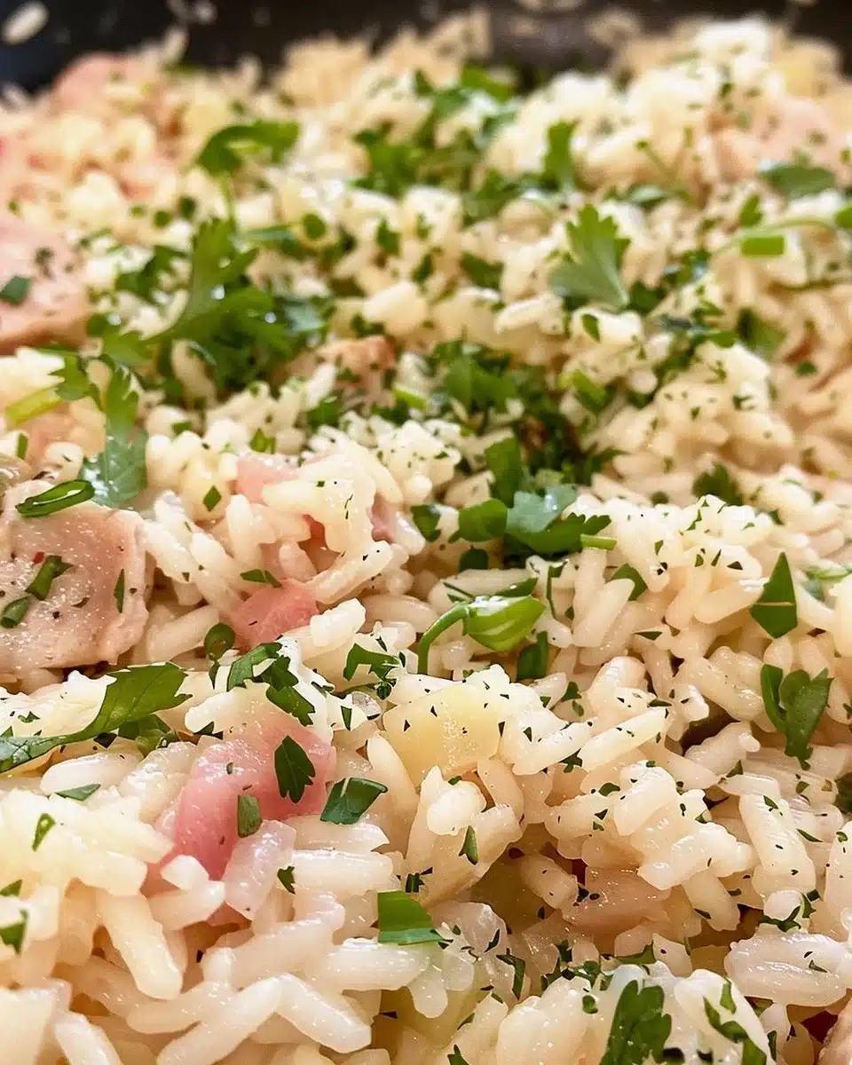 Plate of SPAM risotto with fresh herbs and parmesan cheese