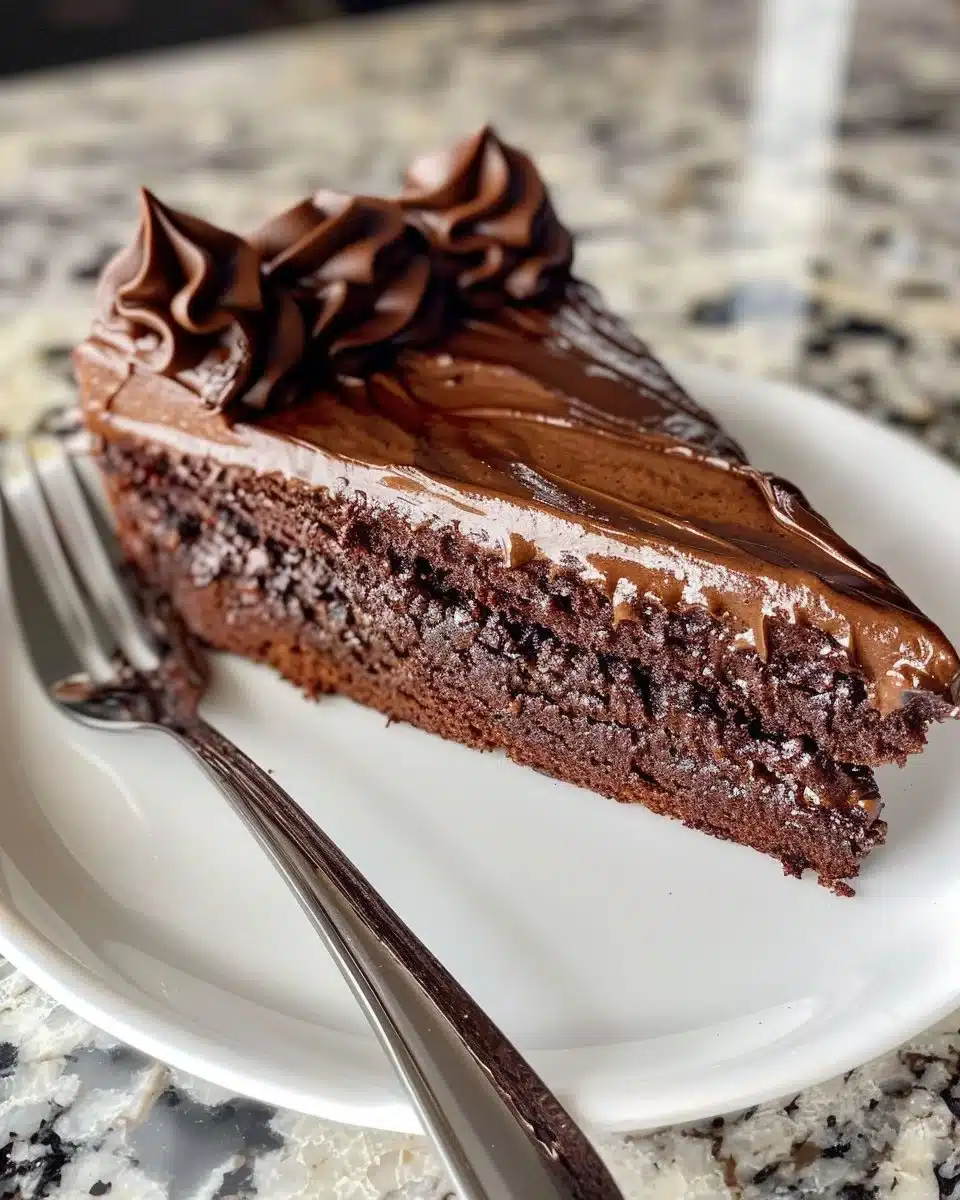 Slice of Brooklyn Blackout Cake with rich chocolate frosting