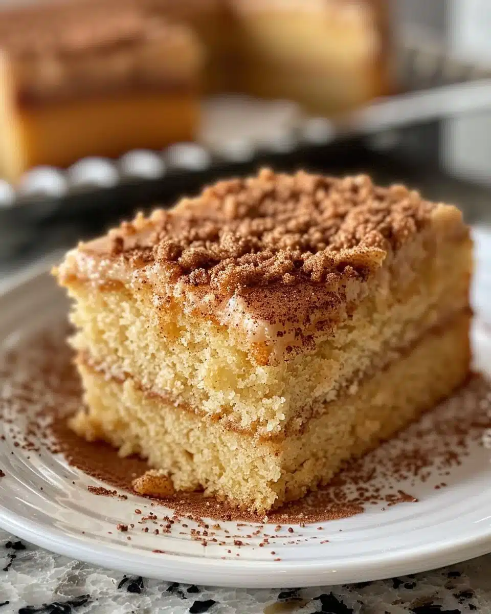 Delicious snickerdoodle layer cake topped with cinnamon sugar