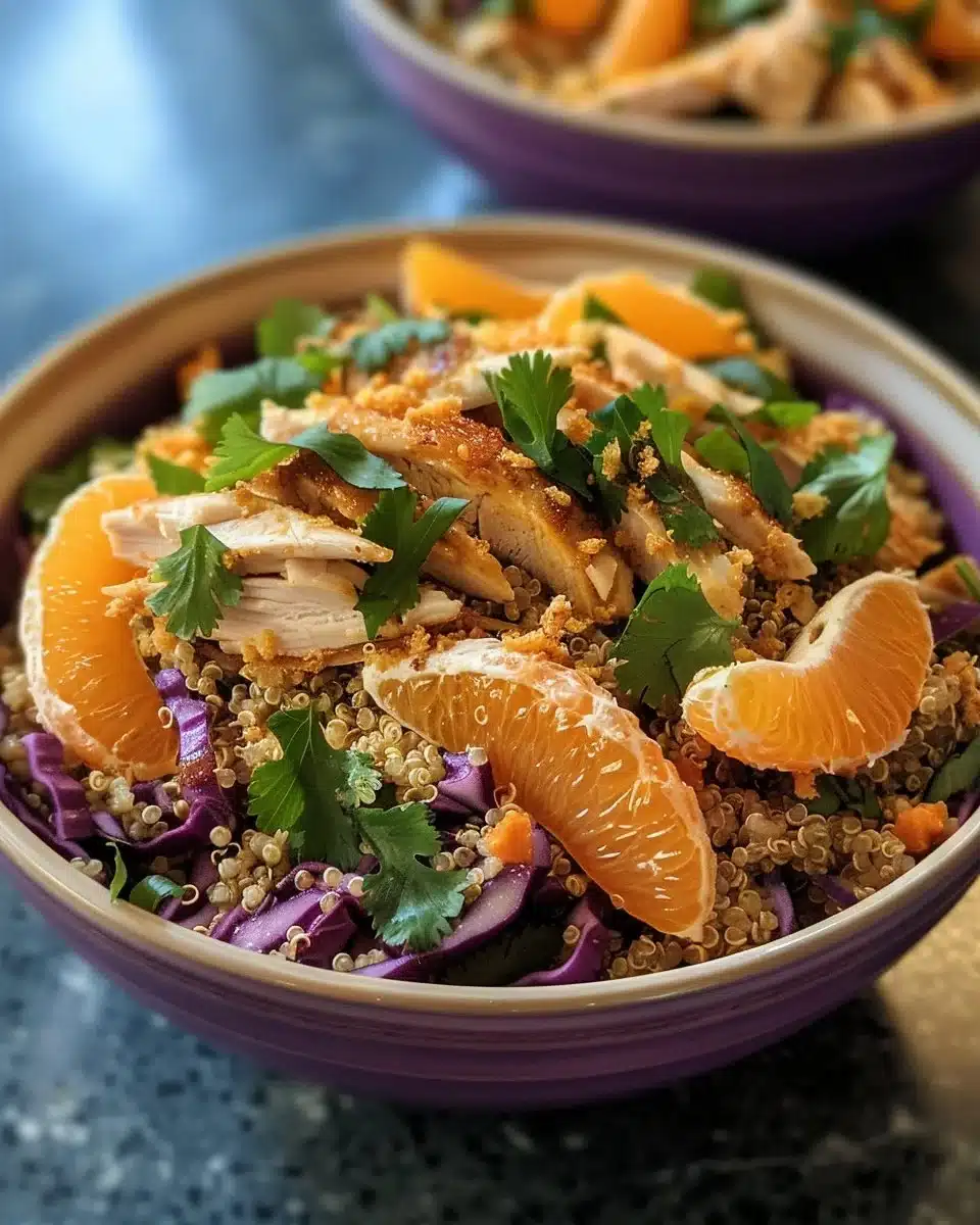 Citrus Chicken Quinoa Salad presented in a bowl with vibrant ingredients.