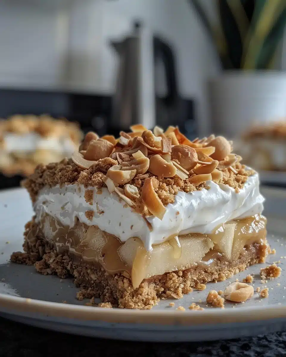 No-bake vegan apple cheesecake jars topped with fresh apples and cinnamon